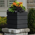 Black modern planter in use
